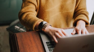 person browsing on laptop